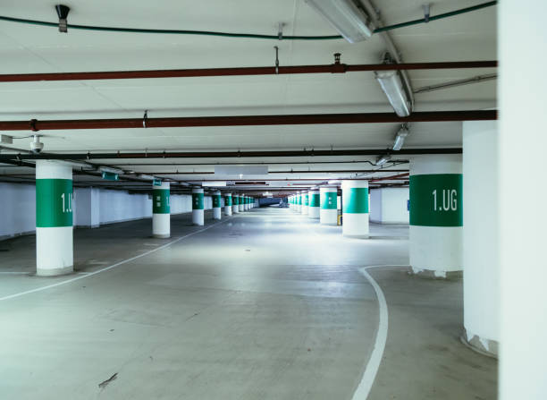 istock Parking garage in the underground. Asphalt and empty parking lots. 1147106812