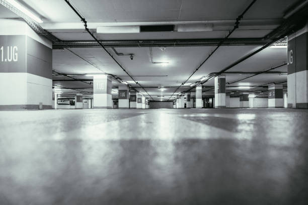 istock Parking garage in the underground. Asphalt and empty parking lots. 1147106832