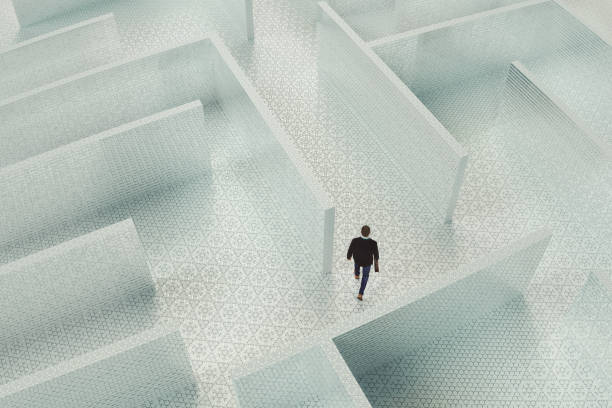 istock Young businessman lost in maze 1147106863