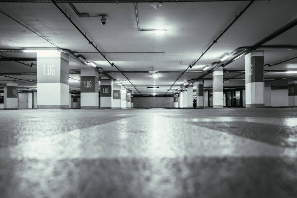 istock Parking garage in the underground. Asphalt and empty parking lots. 1147107042