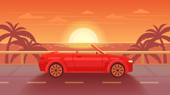 Tropical landscape. The road to the sea at sunset. Red cabriolet.