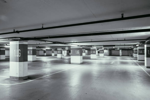 istock Parking garage in the underground. Asphalt and empty parking lots. 1147107442