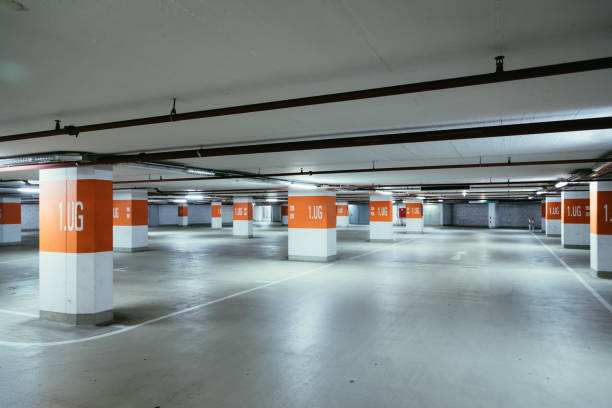 istock Parking garage in the underground. Asphalt and empty parking lots. 1147108209