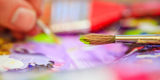 istock Painting artwork: paint brushes on painting background 1147108343