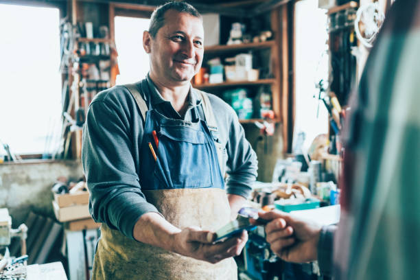 istock Contactless payment in the carpentry workshop 1147108877