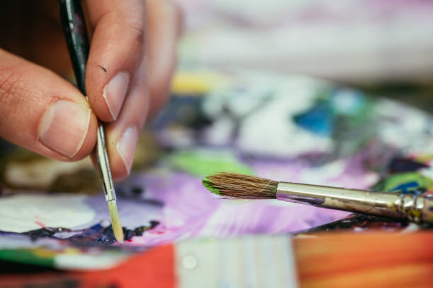 istock Painting artwork: paint brushes on painting background 1147108887