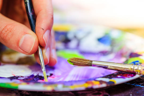 istock Painting artwork: paint brushes on painting background 1147109000