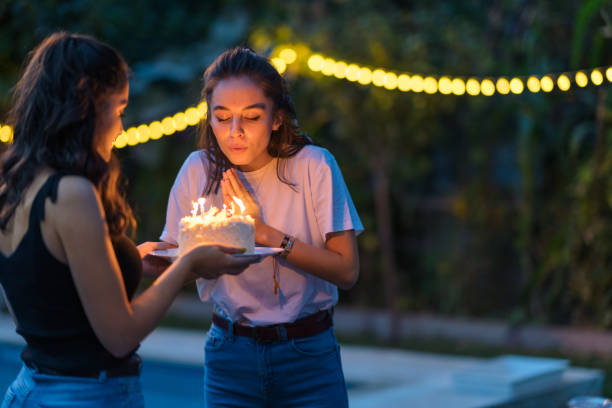 Two female friends celebrating birthday party Two female are friends celebrating birthday party. woman birthday cake stock pictures, royalty-free photos & images