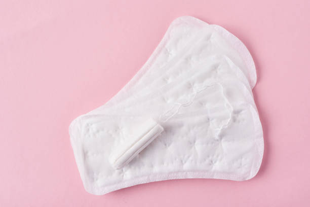 istock Sanitary pad and menstrual tampon on a pink background 1147114072