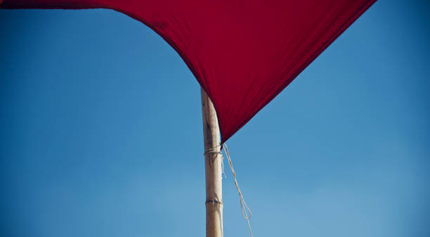 istock Red clothes tied with a bamboo sticks 1147115620