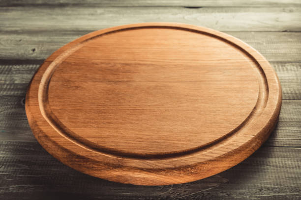 istock cutting board on wooden background 1147117120