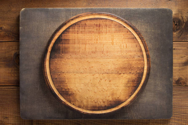 istock cutting board on wooden background 1147117334