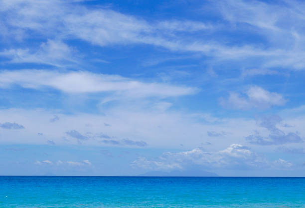 istock Blue sky bleeds into blue water 1147117394