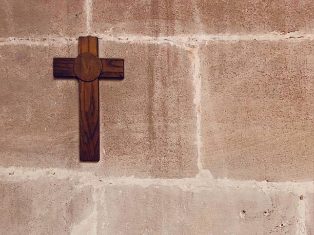 istock Wooden crucifix on wall 1147118434