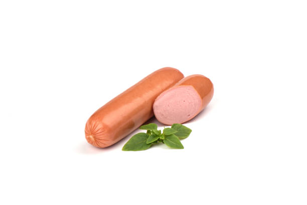 istock Two fresh boiled sausages with basil isolated on white background. 1147120134
