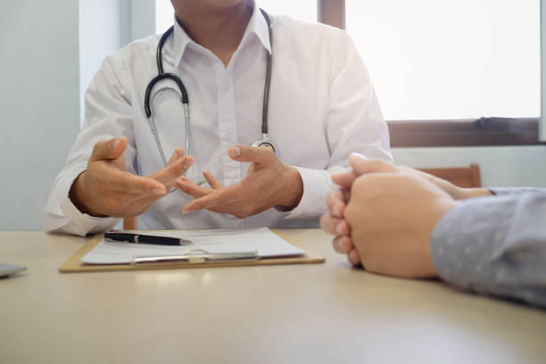 istock Patient having consultation with doctor in office 1147120756