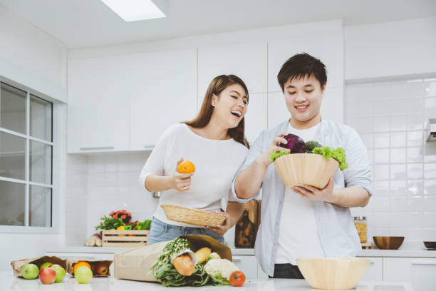 istock Young couple cooking together 1147121037