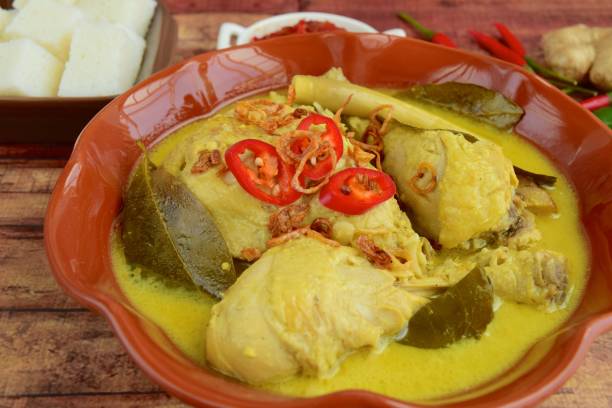 istock Opor ayam, chicken cooked in coconut milk from Central Java, Indonesia. Served with lontong and sambal. Popular dish for lebaran or Eid al-Fitr 1147122020
