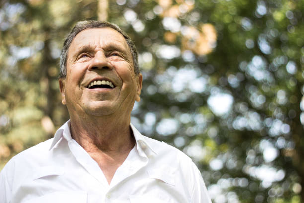 Portrait of a smiling senior man in Nature stock photo