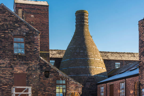 Potteries in Stoke on Trent,Uk Historic buildings of potteries with bottle oven located on banks of Trent and Mersey canal in Stoke on Trent, Staffordshire,Uk.Popular tourists attraction and destination.Industrial architechture. midlands england stock pictures, royalty-free photos & images