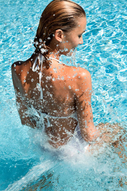 istock relaxed woman in a pool 1147125257