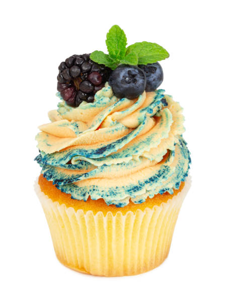 istock Cupcake with fresh blackberry, blueberries and mint 1147126409