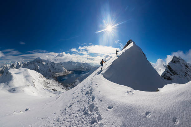 istock Two Lone ski climber on the way to summit  - Mount Pilan - Lofoten 1147127270