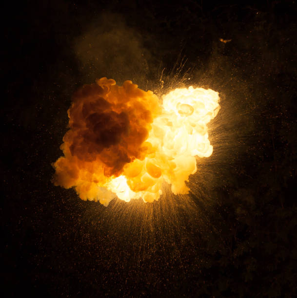 istock Realistic fiery bomb explosion with sparks and smoke isolated on black background 1147129769