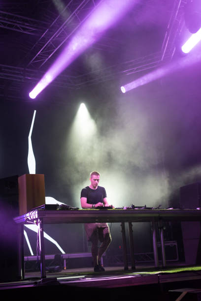 istock Dj playing techno music in the nightclub 1147130259