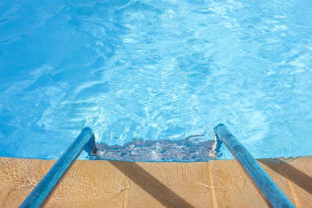 istock Clear blue water and a ladder in the pool 1147131258