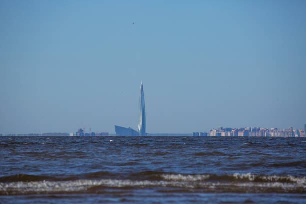 Saint-Petersburg/Russia - 28 April 2019: the beach in the Saint-Petersburg tercentenary park agianst the background of Gazprom tower