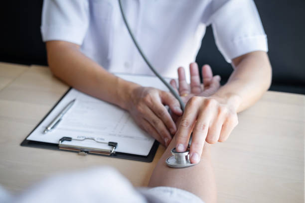 istock Doctor using a stethoscope checking patient with examining, presenting results symptom and recommend treatment method, Healthcare and medical concept 1147136310