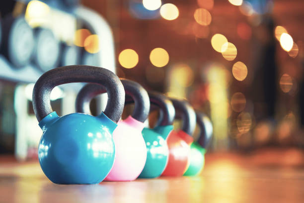istock Colorful kettlebells in gym 1147137277