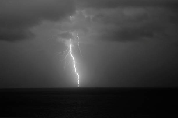 istock Lightning Strike over the Atlantic Ocean captured in black and white 1147137529