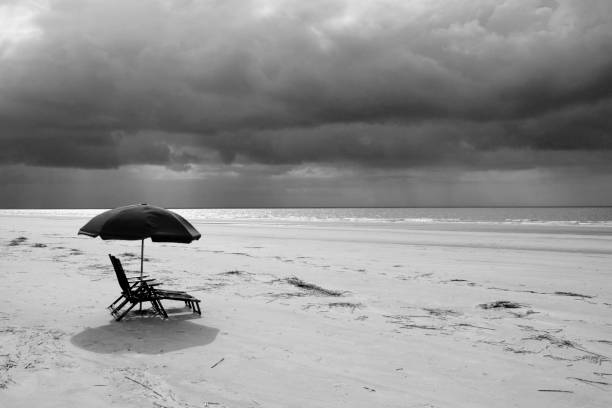 istock Raining at the Beach captured in black and white 1147137903