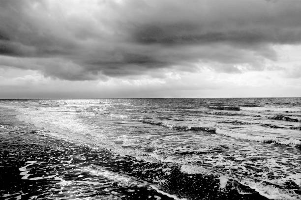 istock Sunrise Over the Atlantic Ocean captured in black and white 1147138598