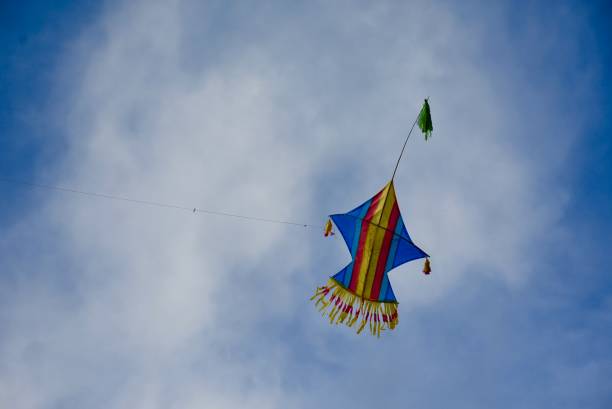 istock Colorful kite flying in the blue sky 1147139143