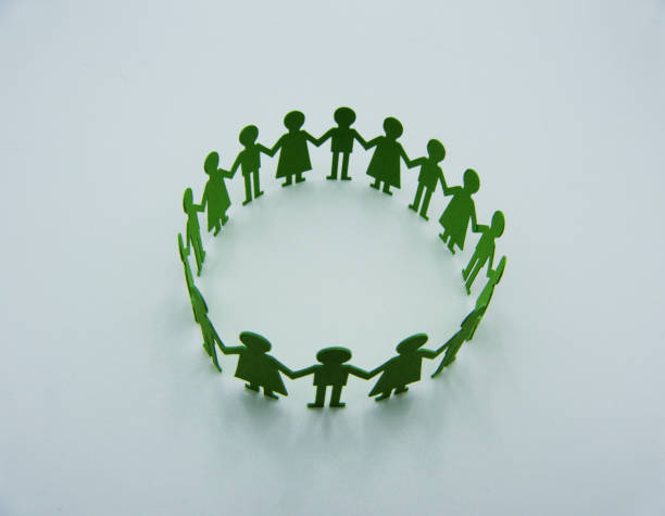 istock Paper children figurine make a circular dance on white background 1147139695