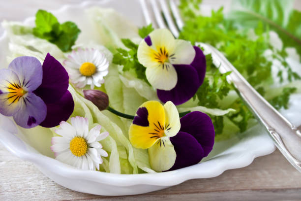 istock Fresh salad with various eatable flowers 1147141244