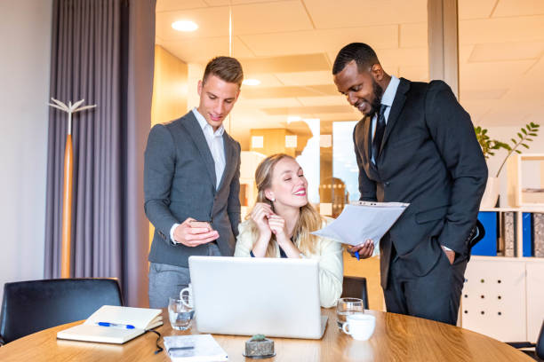 istock Group of business people at the office 1147146985