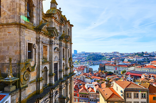 Stunning panoramic aerial view of traditional historic buildings in Porto. Vintage houses with red tile roofs. Famous touristic place and travel destination in  Portugal
