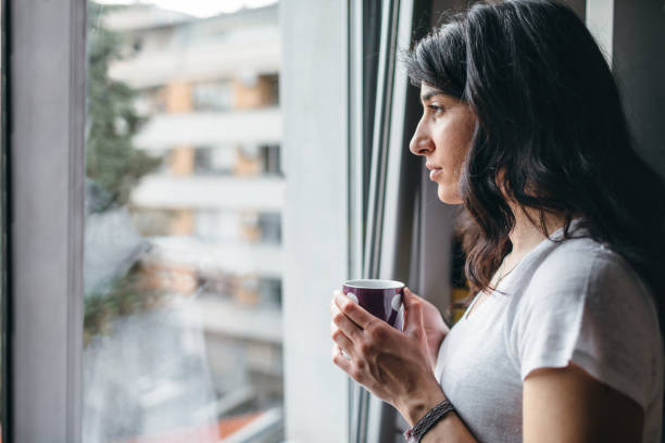 istock Young Woman Drinking Tea At Home 1147153275