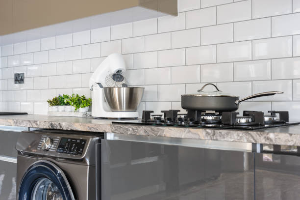 istock Closeup of luxury modern white, beige and grey kitchen interior 1147153818