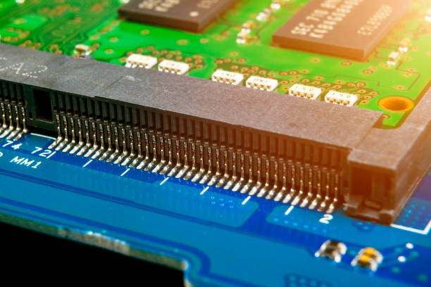 istock Macro shot of Circuit board with resistors microchips and electronic components. Computer hardware technology. Integrated communication processor. Information engineering. Semiconductor. PCB. Closeup 1147154532