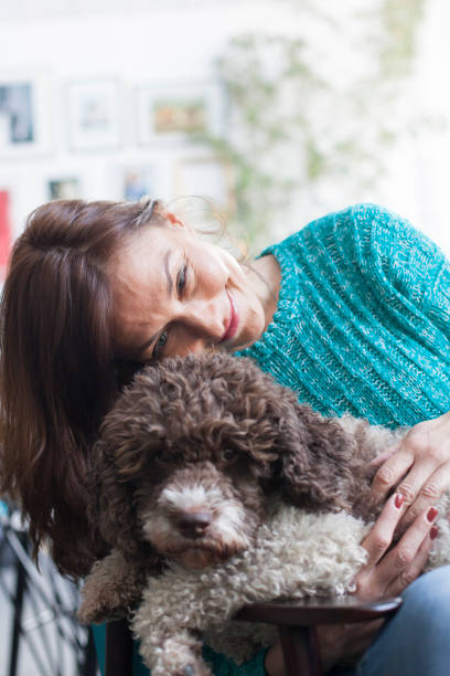 istock beautiful woman posing with her dog 1147156176