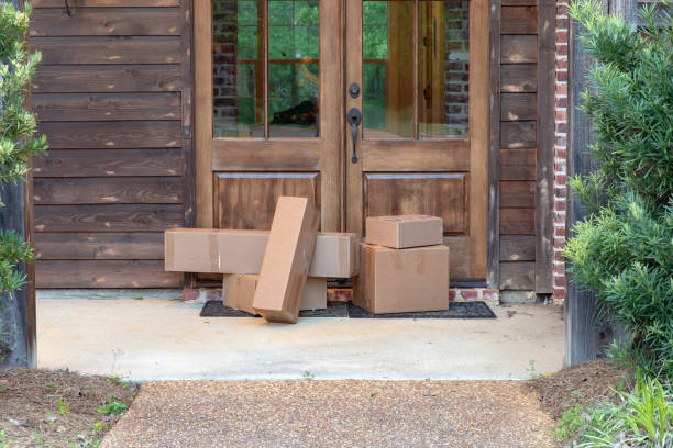 Boxes on front porch, delivered from postal service Boxes of merchandise from shopping online doorstep stock pictures, royalty-free photos & images