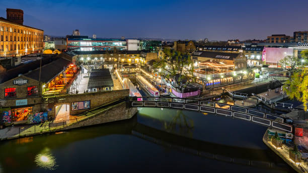 London, United Kingdom - April 14, 2019: Camden Lock and Camden Market at night. This is a very popular destination for locals and tourists. The market is very busy by day and there are bars, restaurants and nightclubs too.