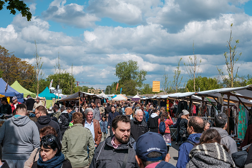Berlin, Germany - May, 2019: People on flea market at Mauerpark on sunday in Berlin