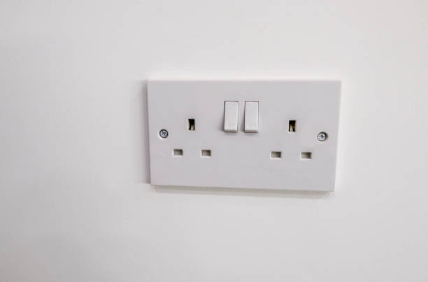 istock Double electric plug socket with two switches to turn on and off. 1147159760