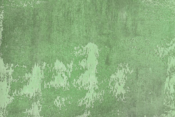 istock Old wall painted with green paint. Uneven texture, with stains and smudges. Blank background for layouts. 1147162681